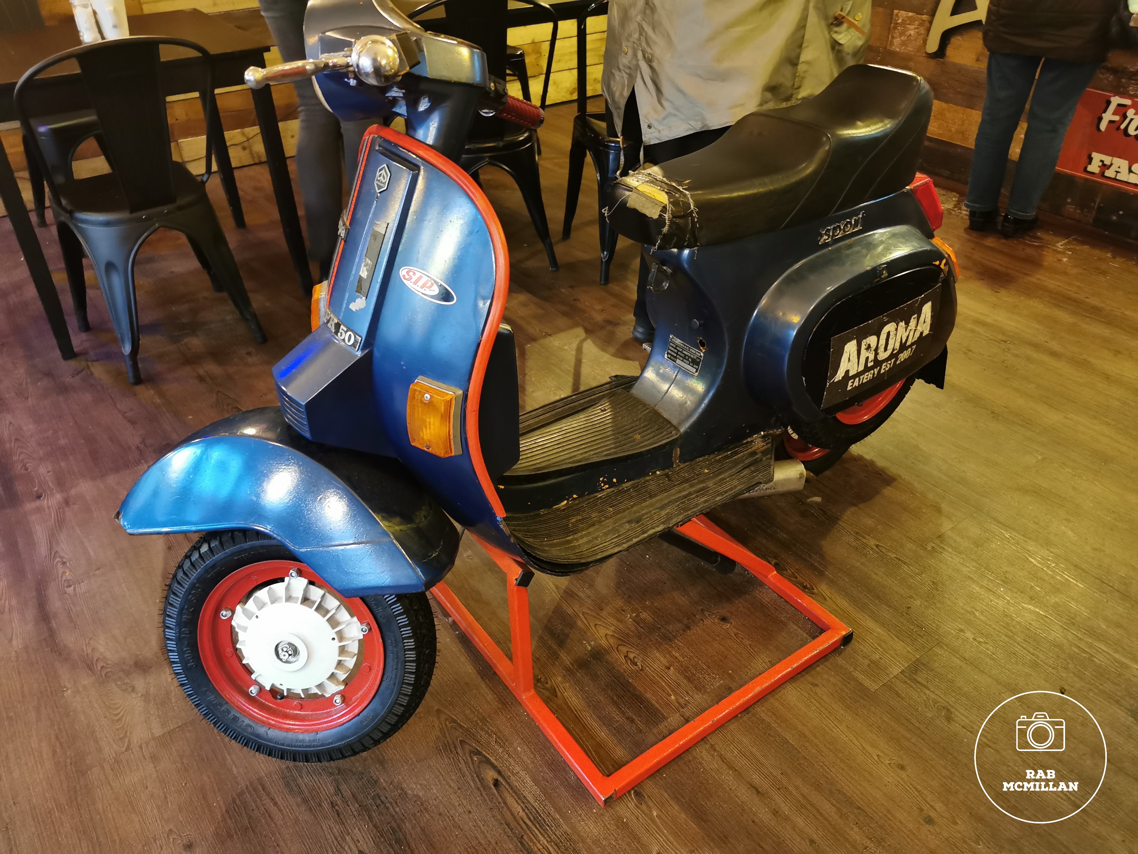 Scooter in Aroma Coffee and Kitchen, Stewarton Street, Wishaw, 2022.