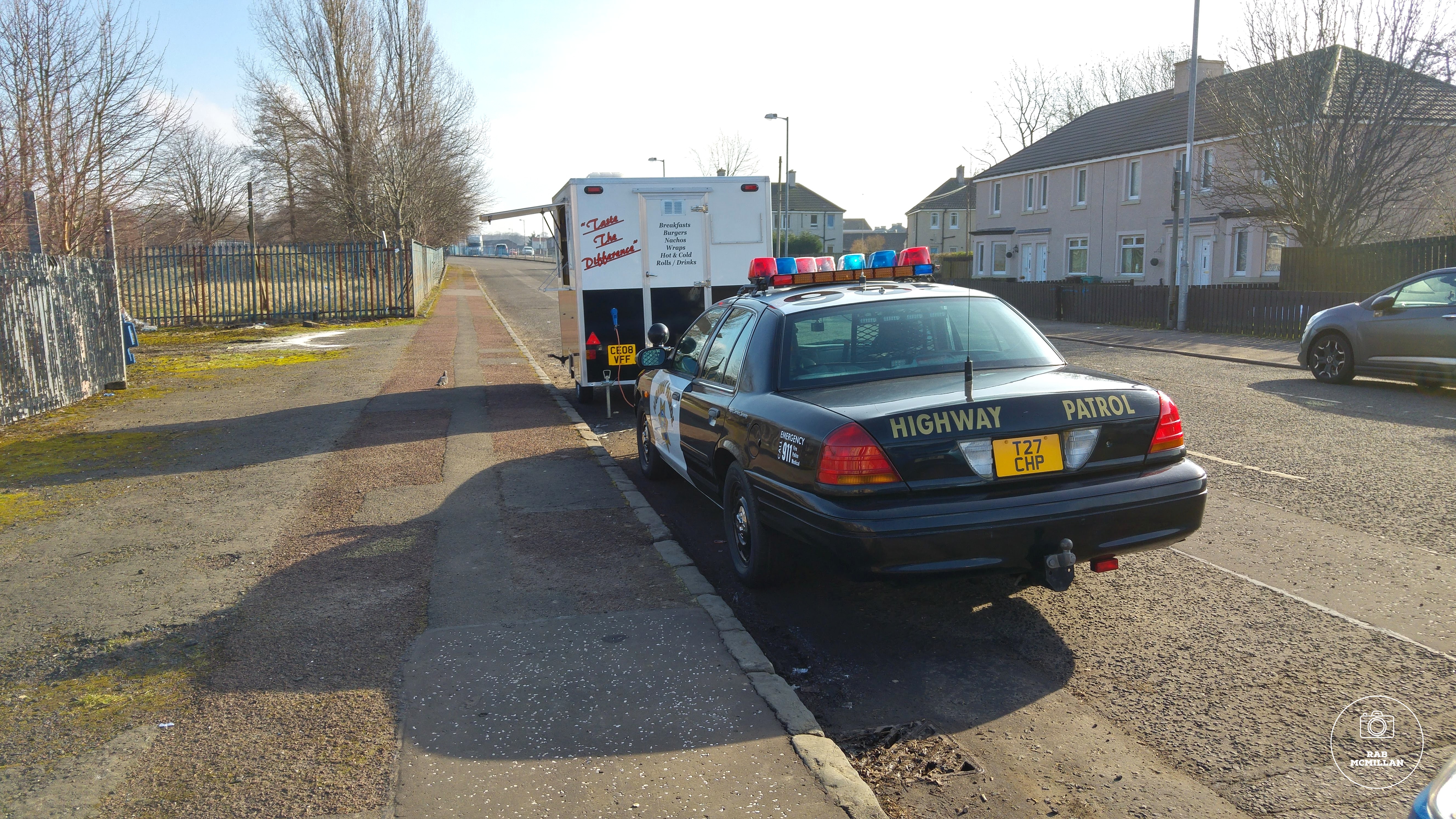 Snack Van and American Highway Patrol car at the old Ravenscraig Steelworks entrance, Meadowhead Road, Craigneuk, Wishaw, 2016.