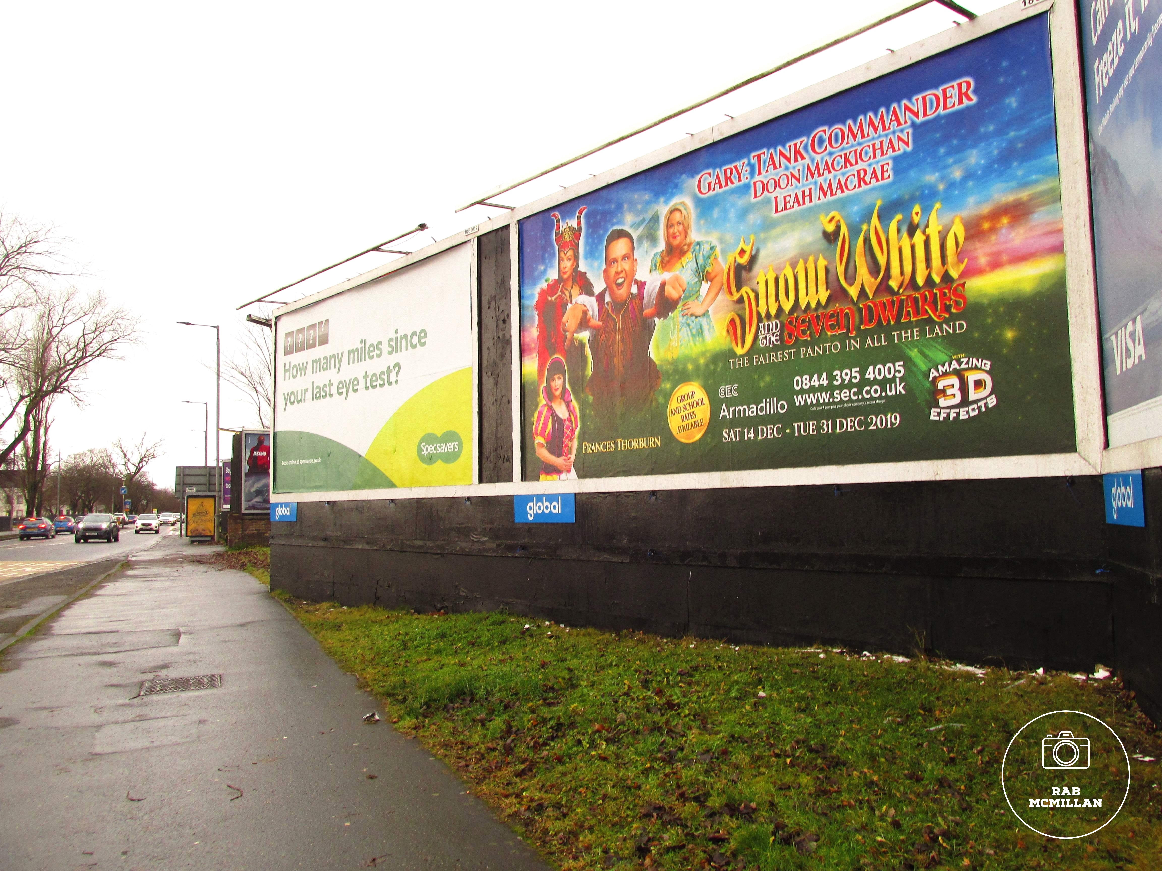 Billboard for Pantomime starring Gary Tank Commander in Snow White, Glasgow Road, Wishaw, 2019.