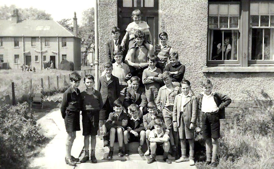 Robert Watt on his pal's shoulder after being carried home from Craigneuk Public School for winning the Dux medal in 1949. Robert would emigrate to America where he worked in the space industry and desiged parts for Gemini, Apollo and Space Shuttle Missions, earning him many awards. Photo taken in Golfhill Road, Craigneuk, Wishaw.