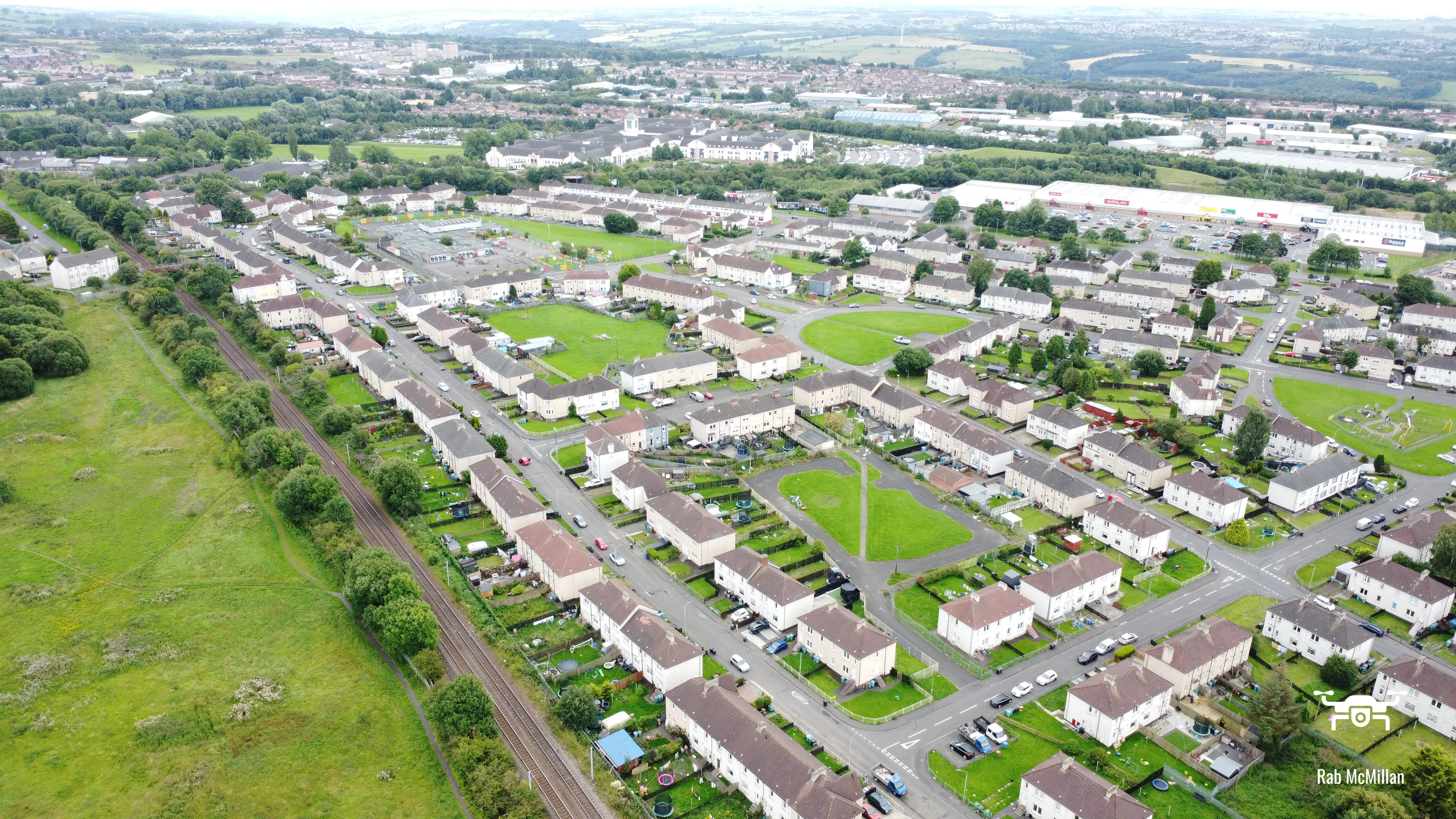 Craigneuk with a view to Caledonian Retail Park and University Hospital, Wishaw, 2023.