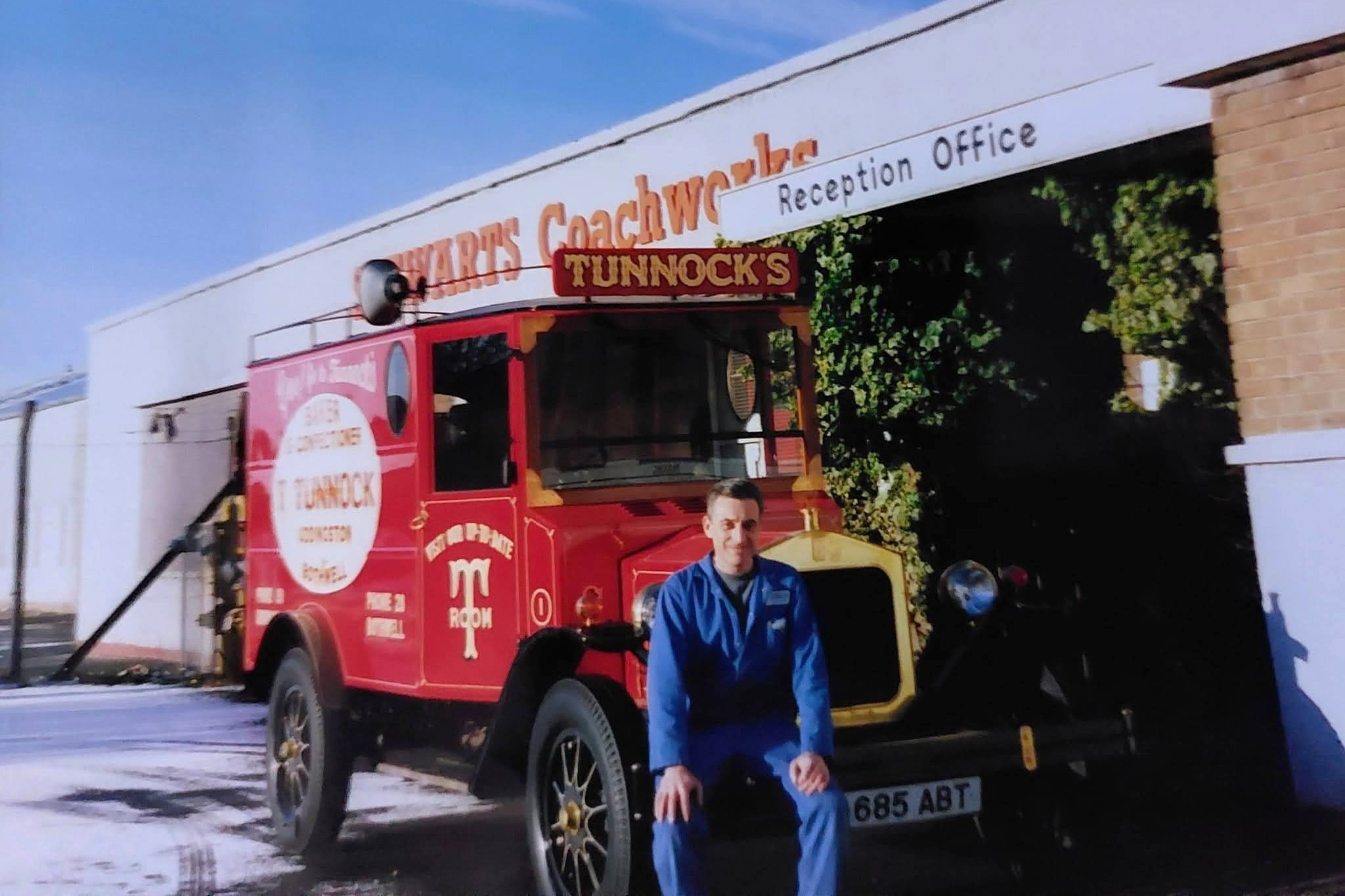 Scott Devine next to a Tunnock's Replica Vintage Truck that was in for repair at Stewarts Coachworks, Gowkthrapple, Wishaw. Stewarts originally done the painting and lettering of the truck in 1985. Pic courtesy of Frankie Devine.
