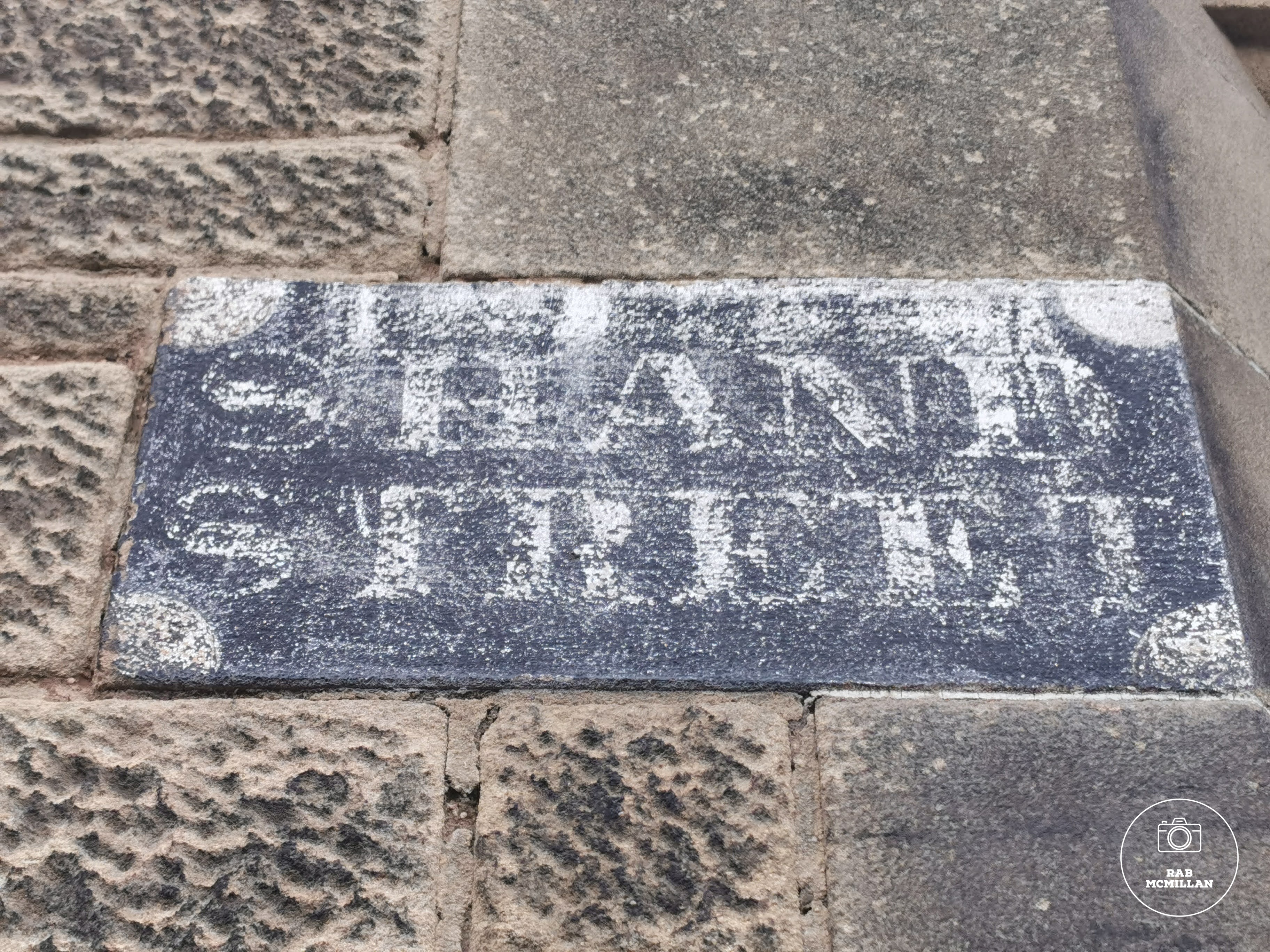 Original street sign on the Charles Reid Studio Building, corner of Young Street and Shand Street, Wishaw.