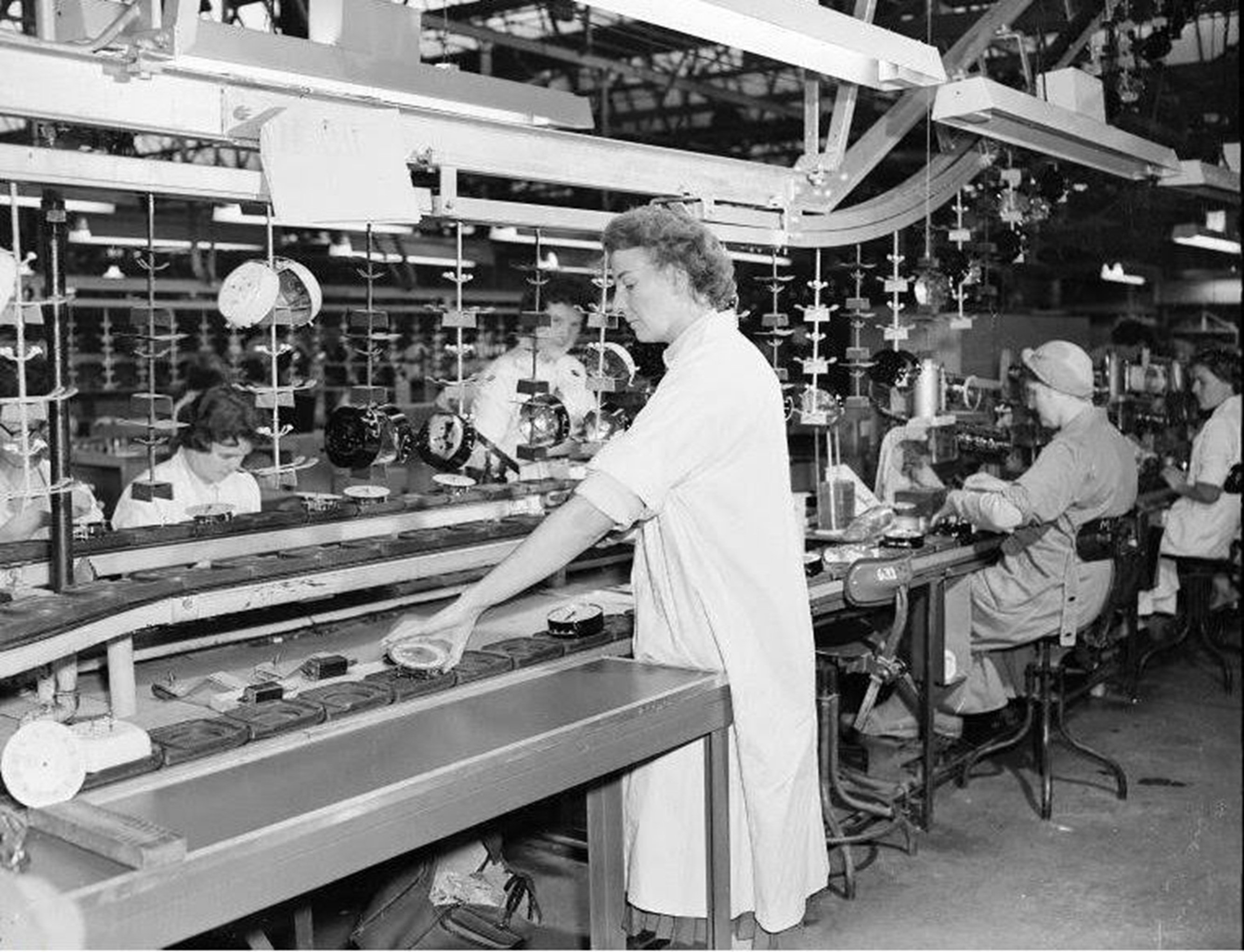 Assembly line workers at Smiths Clock Works, Gowkthrapple, Wishaw, 1954.