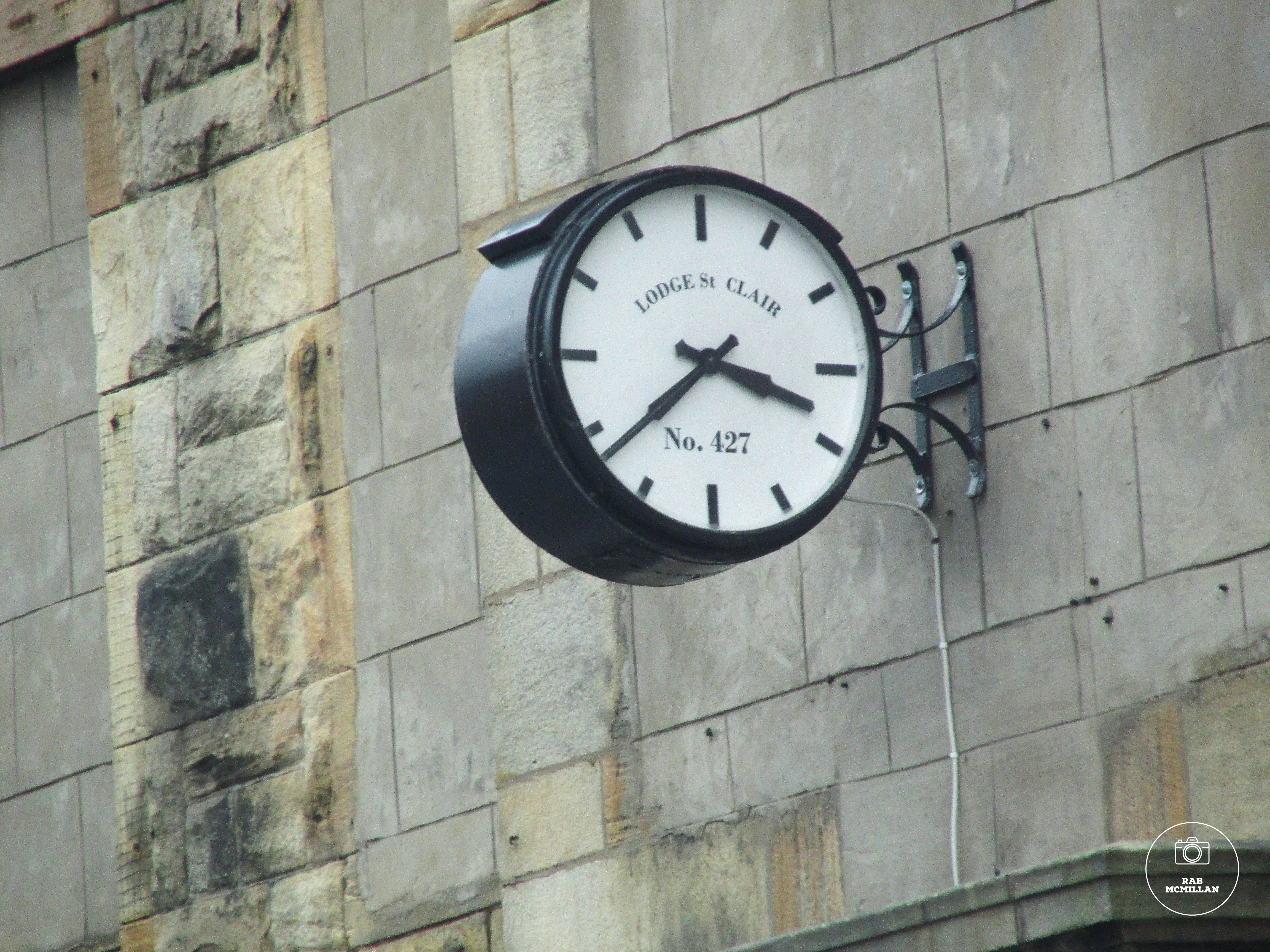 Lodge St Clair, Cambusnethan, Wishaw, 2015. This clock was originally on the wall of T.& J. W. Graham Post Office, Cambusnethan and was saved for the community by the Lodge.